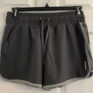 Reebok dark gray Women’s Athletic Shorts with light Gray Trim. Size large $10